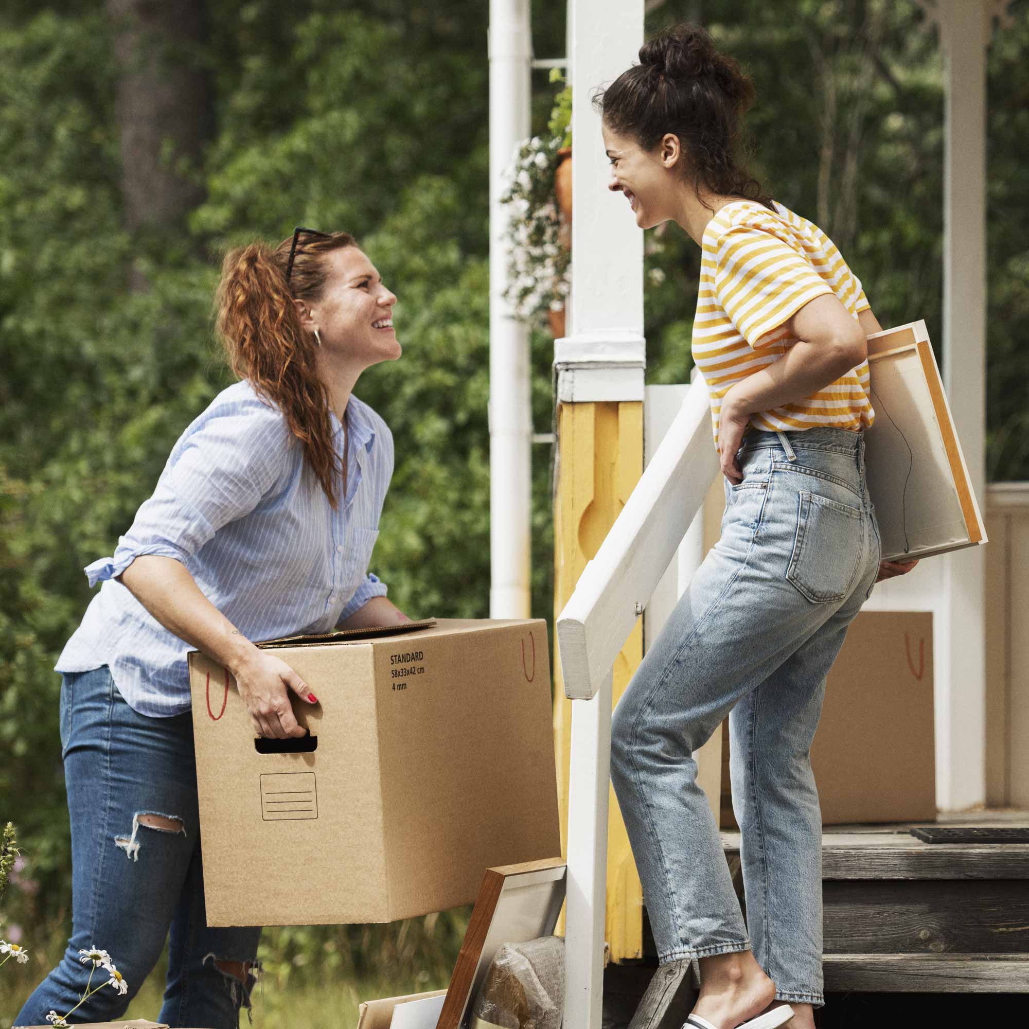 Two women with moving boxes